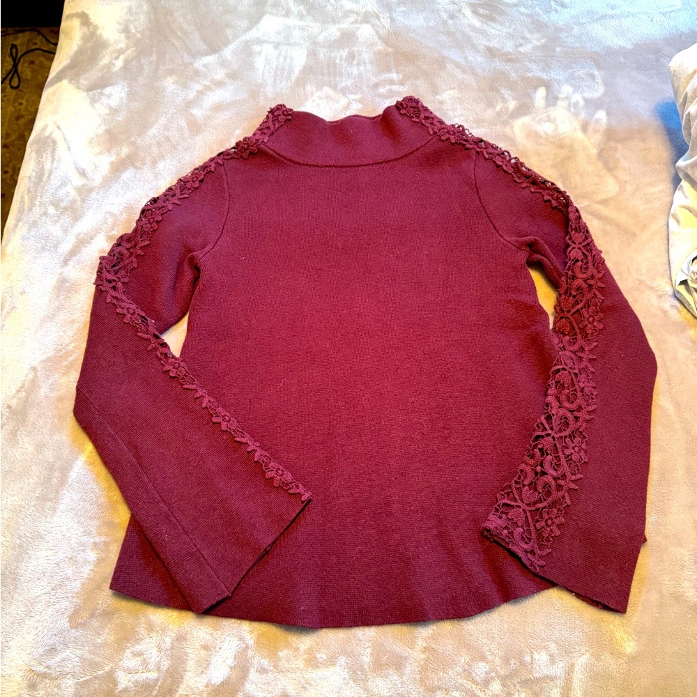 Anthropologie Mock neck sweater with open work sleeve. Size XS